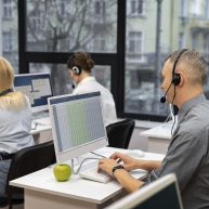 colleagues-working-together-call-center-with-headphones colleagues-working-together-call-center-with-headphones