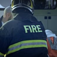 Paramedics and firemen standing at car crash accident. Paramedics and firemen standing at car crash accident.