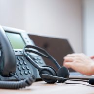 headset-with-blurred-call-center-employee-hand-working-operation-room_42708-612 headset-with-blurred-call-center-employee-hand-working-operation-room_42708-612